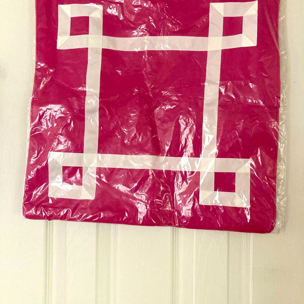 Pillow sham in bright pink with white trim